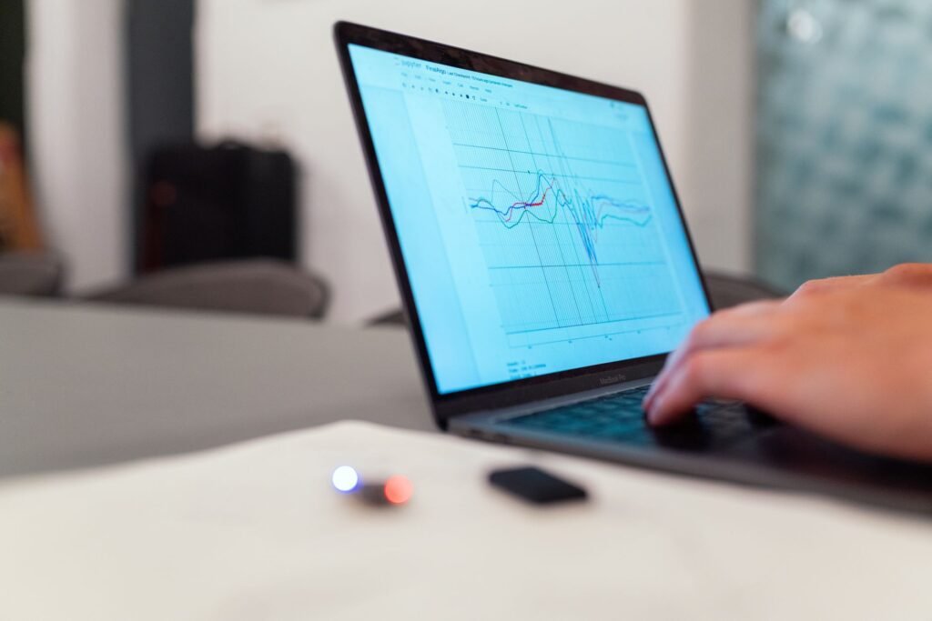 Person privately comparing online profiles on a laptop
